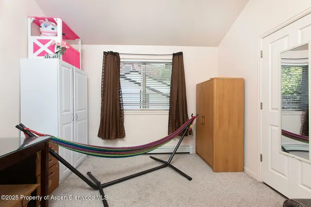 a view of a hallway with workspace