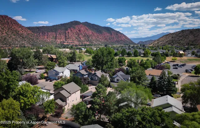 a view of a city with mountains in the background
