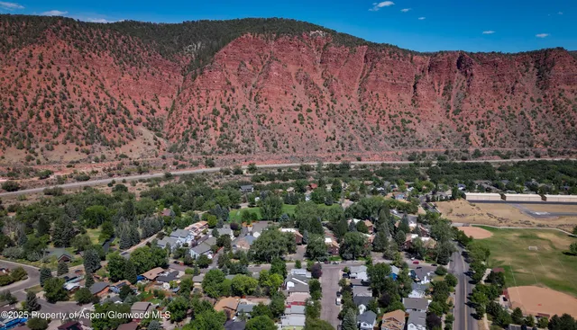 a view of a city with mountains in the background