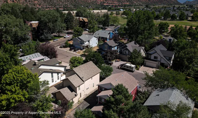 an aerial view of a house with mountain view