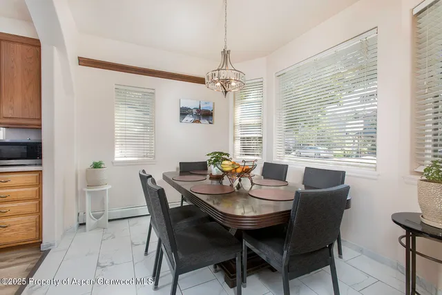 a view of a dining room with furniture window and outside view