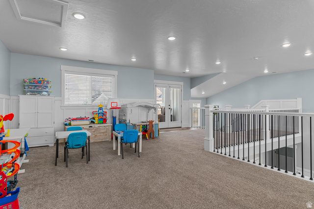 1426 South 1450th Street West Mapleton, UT 84664 - Photo 27 of 50 Spacious carpeted room featuring light blue walls with white wainscoting, recessed lighting, and a white window with blinds