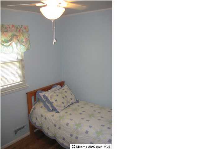 70 Darien Road Howell, NJ 07731 - Photo 14 of 26 a view of a room with wooden floor