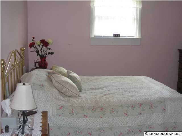 70 Darien Road Howell, NJ 07731 - Photo 15 of 26 a view of a bedroom with a bed