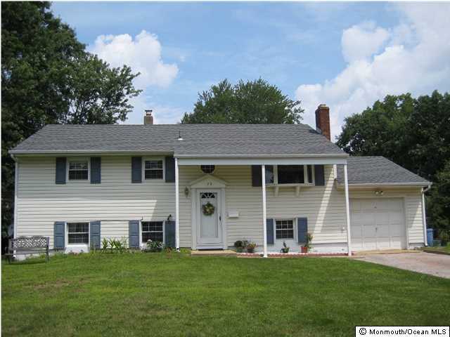 70 Darien Road Howell, NJ 07731 - Photo 26 of 26 a front view of a house with a garden