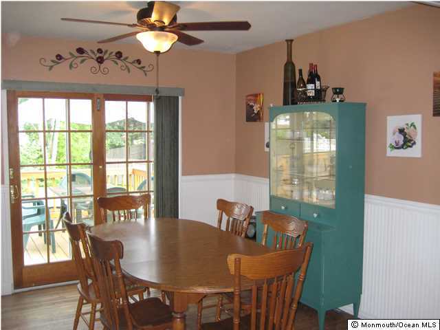 70 Darien Road Howell, NJ 07731 - Photo 4 of 26 a dining room with furniture a chandelier and wooden floor