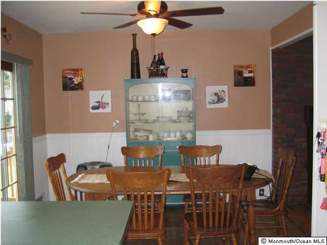 70 Darien Road Howell, NJ 07731 - Photo 5 of 26 a view of a dining room with furniture and chandelier