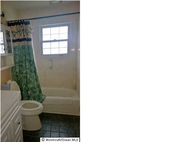 70 Darien Road Howell, NJ 07731 - Photo 10 of 26 a bathroom with a toilet and a shower