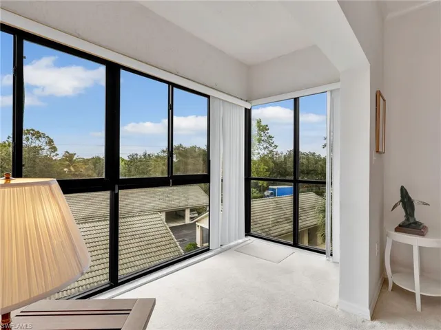 a view of a floor to ceiling window and a balcony