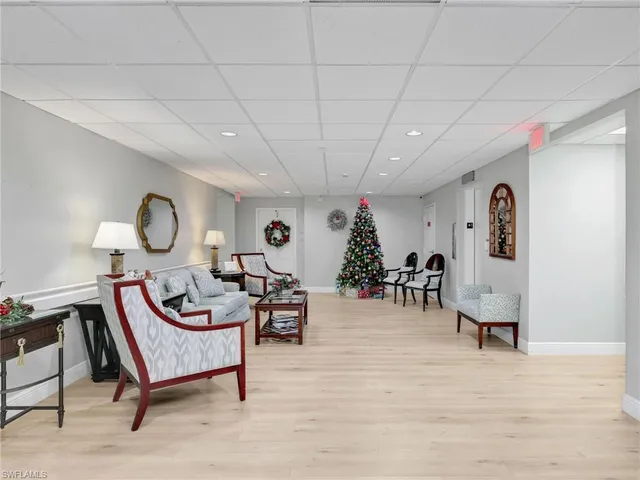 a living room with furniture a window and a table