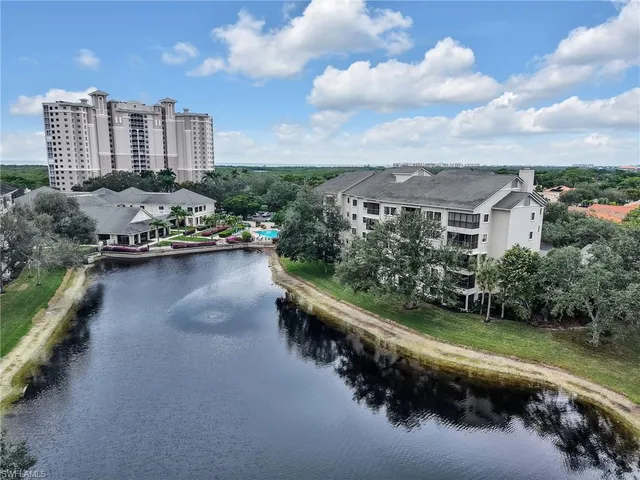 an aerial view of a house with a lake view