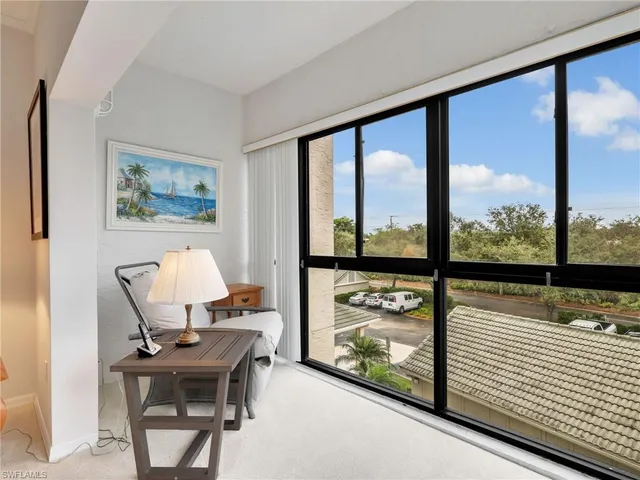 a view of a living room and dining room