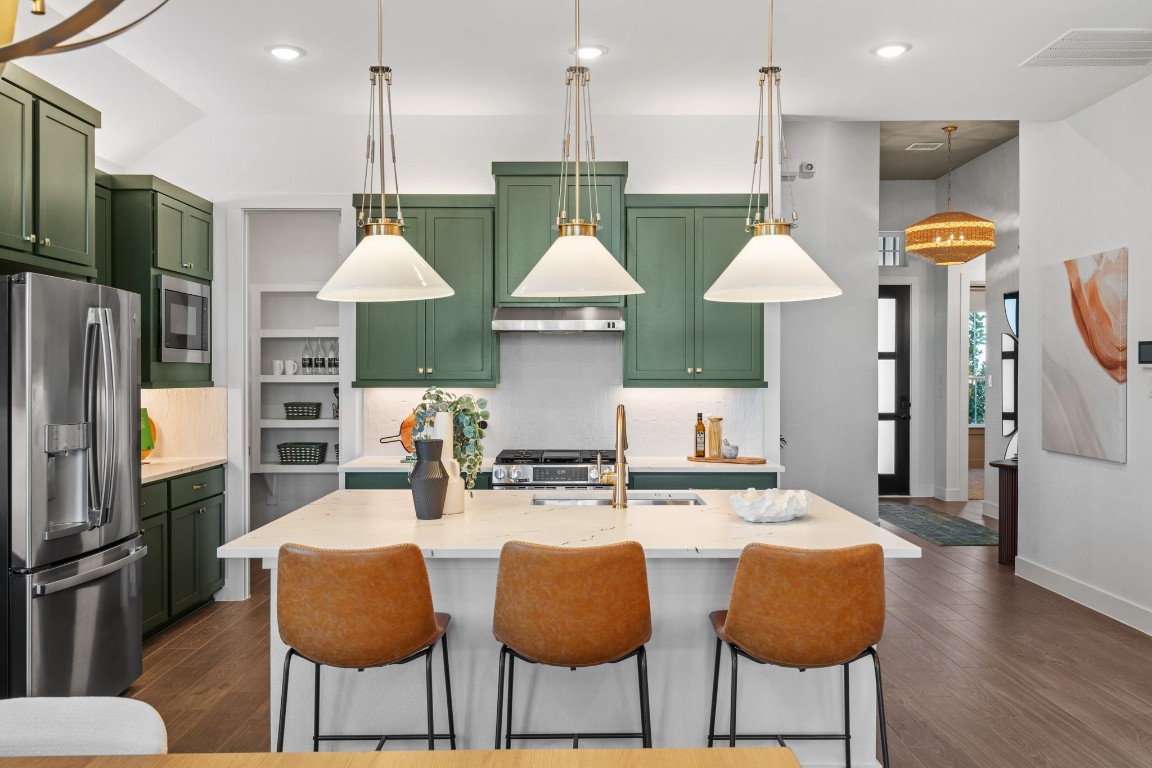 130 Afton June Drive Rosenberg, TX 77471 - Photo 13 of 36 a kitchen with stainless steel appliances granite countertop a sink refrigerator and cabinets