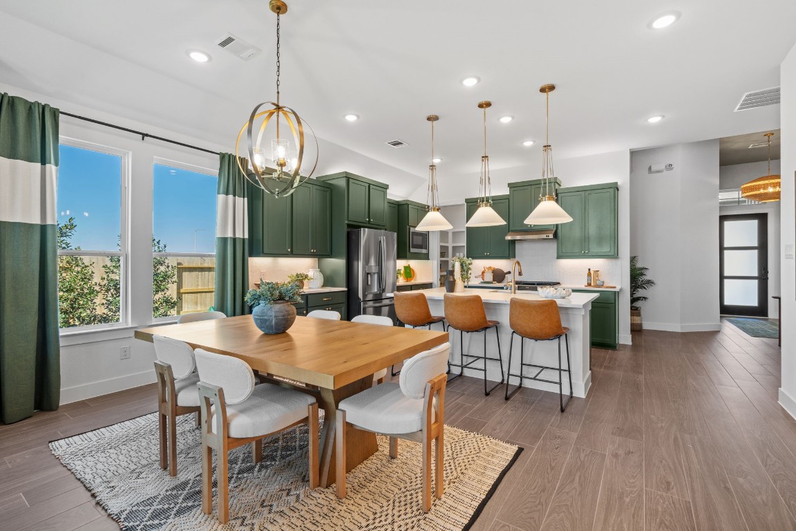 130 Afton June Drive Rosenberg, TX 77471 - Photo 14 of 36 a view of a dining area with furniture and wooden floor