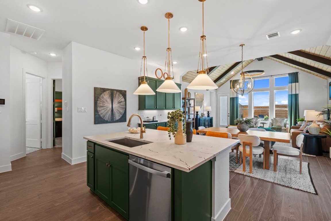 130 Afton June Drive Rosenberg, TX 77471 - Photo 16 of 36 a kitchen with stainless steel appliances granite countertop a sink a stove and a wooden floors