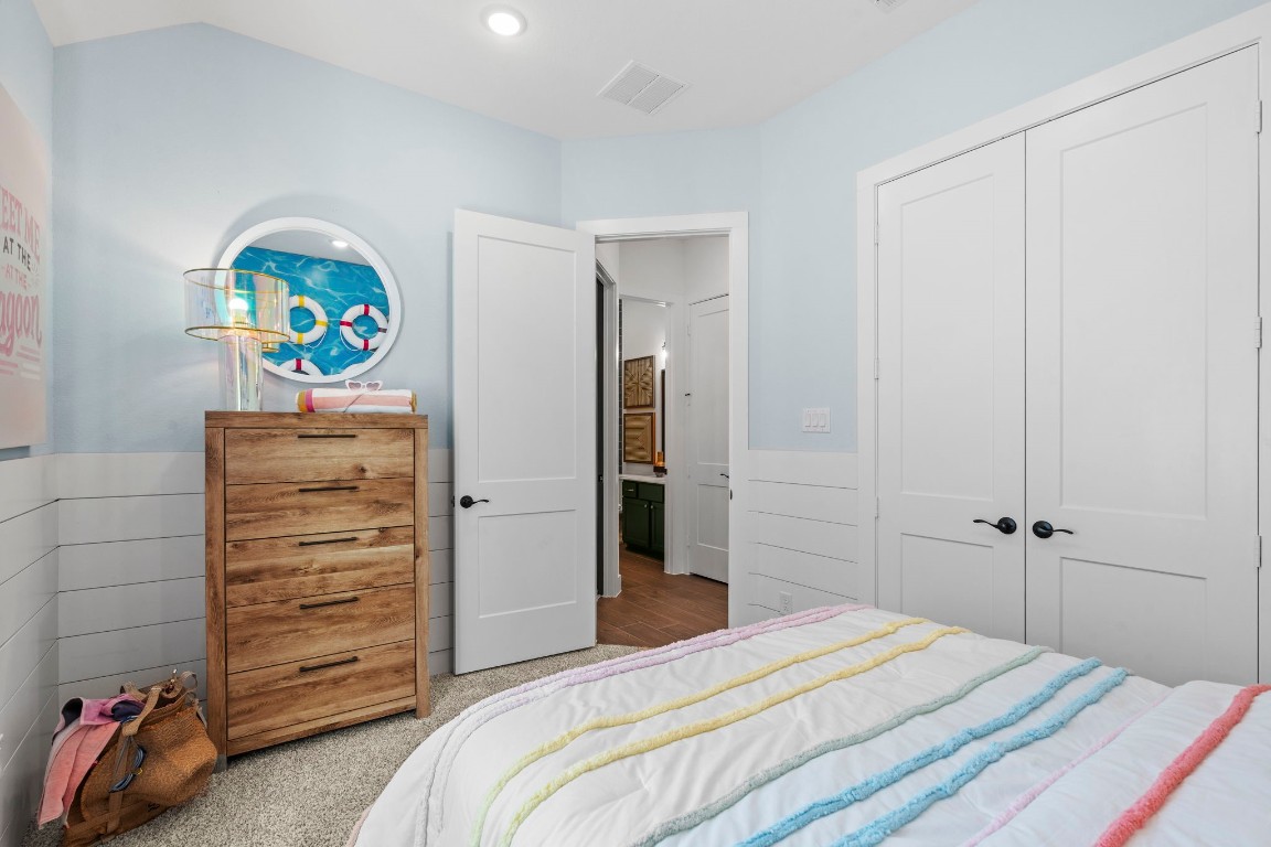 130 Afton June Drive Rosenberg, TX 77471 - Photo 18 of 36 a bedroom with a bed and a cabinets