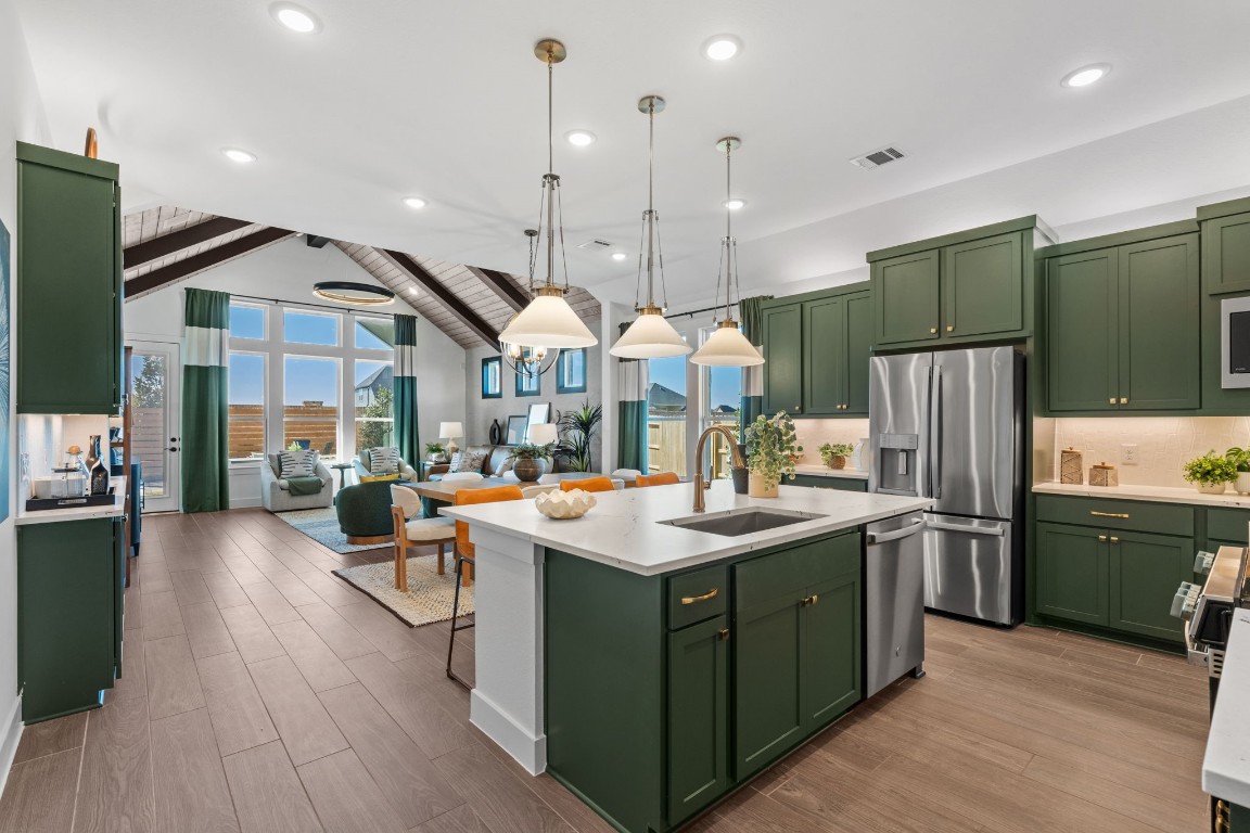 130 Afton June Drive Rosenberg, TX 77471 - Photo 8 of 36 a kitchen with stainless steel appliances granite countertop a sink a stove and a refrigerator