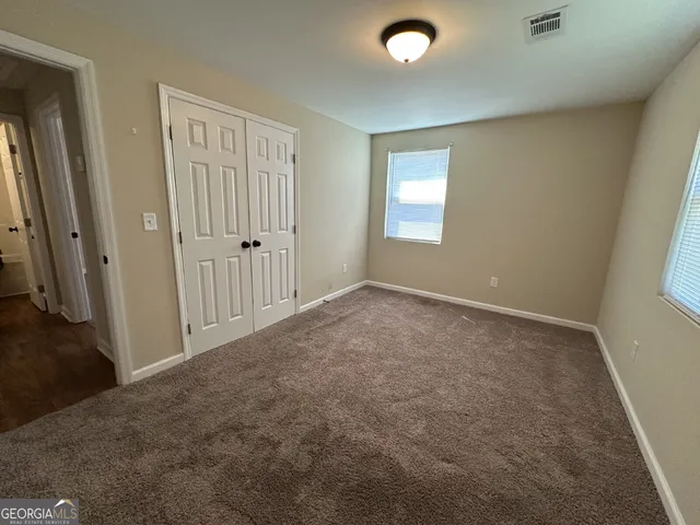 an empty room with windows