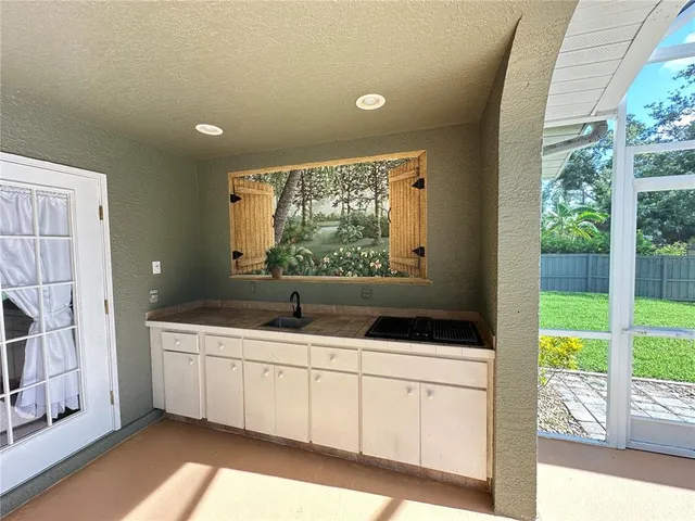 a living room with a large window and a flat screen tv