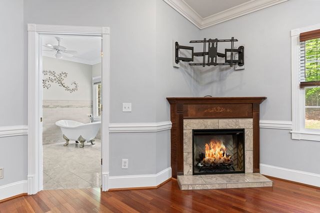 1190 Maple Grove Road Morganton, GA 30560 - Photo 46 of 96 a living room with a fireplace with wooden floor