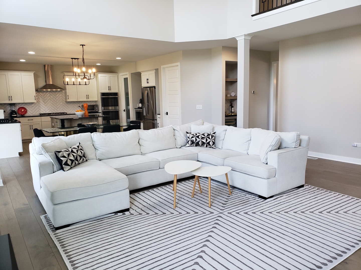 4327 Carpenter Road Naperville, IL 60564 - Photo 15 of 42 a living room with furniture and a dining table with kitchen view