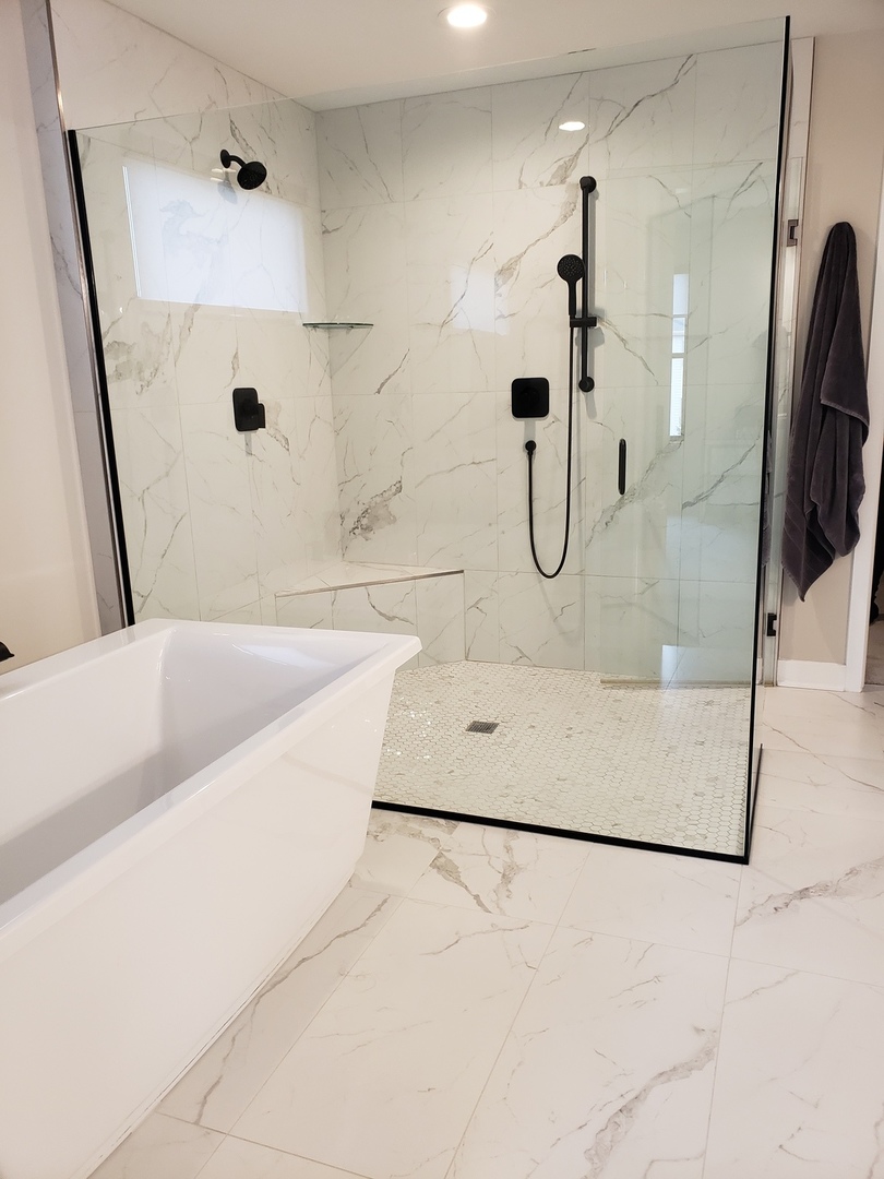 4327 Carpenter Road Naperville, IL 60564 - Photo 23 of 42 a bathroom with a bathtub and a shower