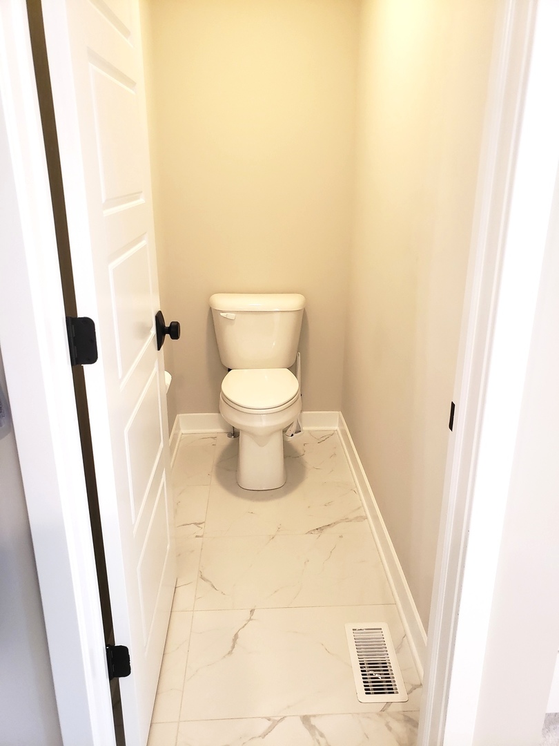 4327 Carpenter Road Naperville, IL 60564 - Photo 27 of 42 a bathroom with a sink and a toilet