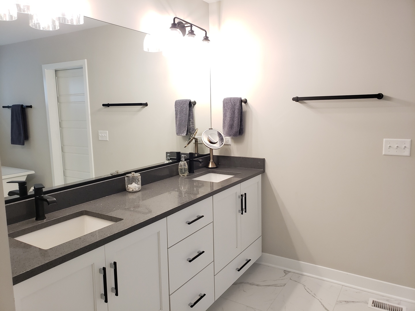 4327 Carpenter Road Naperville, IL 60564 - Photo 29 of 42 a bathroom with a double vanity sink and mirror