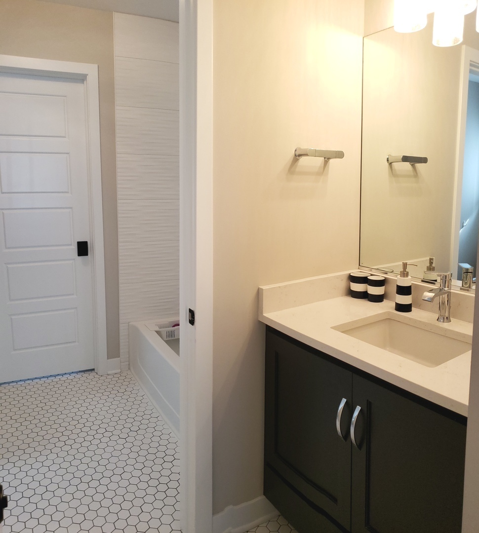 4327 Carpenter Road Naperville, IL 60564 - Photo 33 of 42 a bathroom with a sink and a mirror