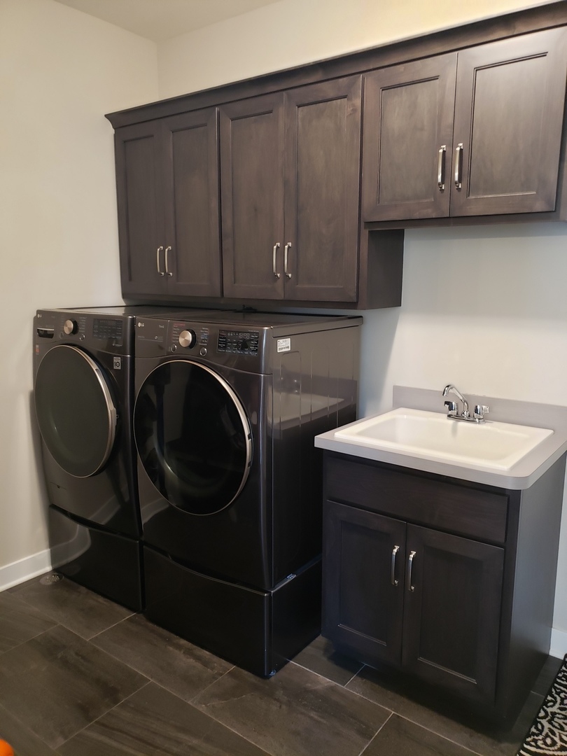 4327 Carpenter Road Naperville, IL 60564 - Photo 38 of 42 a utility room with cabinets