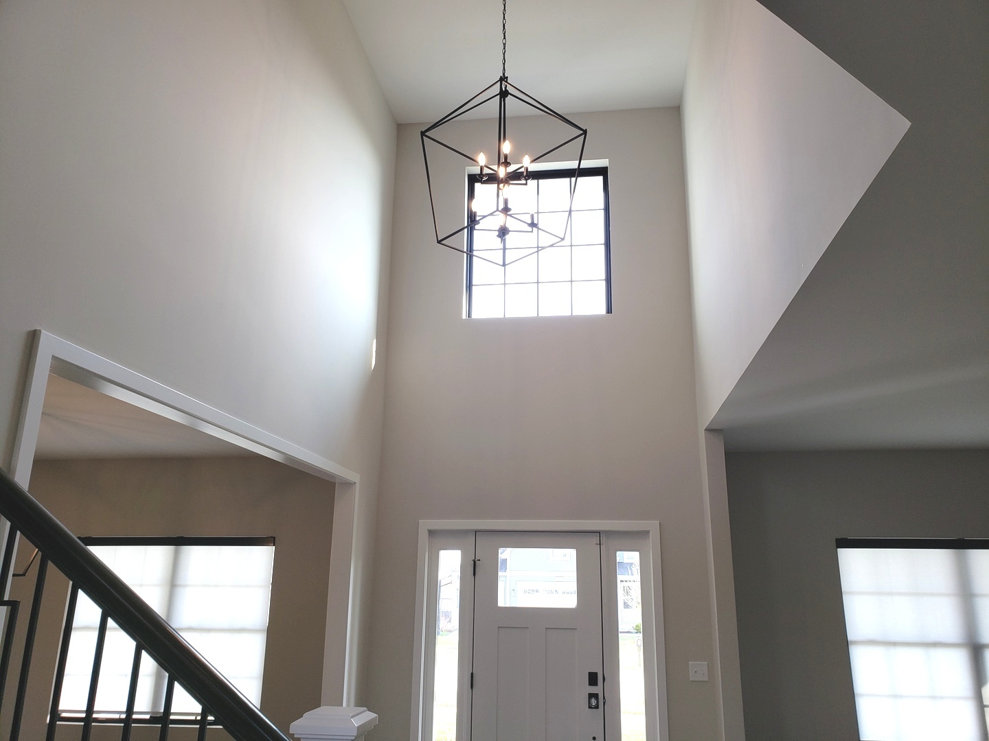 4327 Carpenter Road Naperville, IL 60564 - Photo 4 of 42 a hallway with windows and chandelier