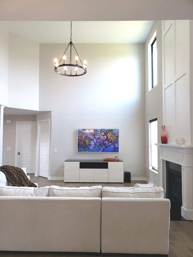 4327 Carpenter Road Naperville, IL 60564 - Photo 9 of 42 a living room with couch and a fireplace