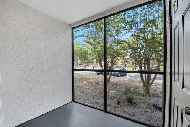 a view of a park with large trees