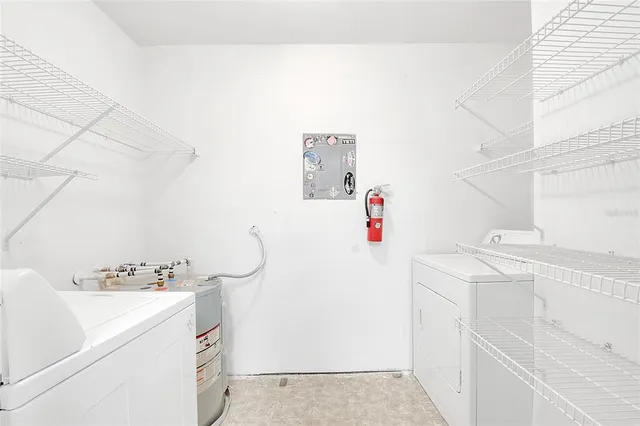 a view of a hallway with wooden floor and a window