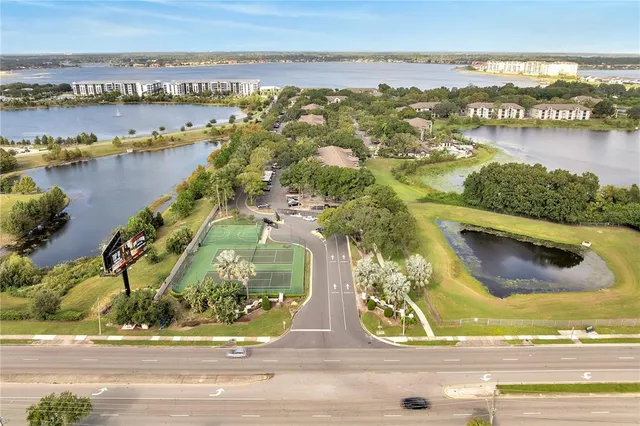 an aerial view of a city with lake view