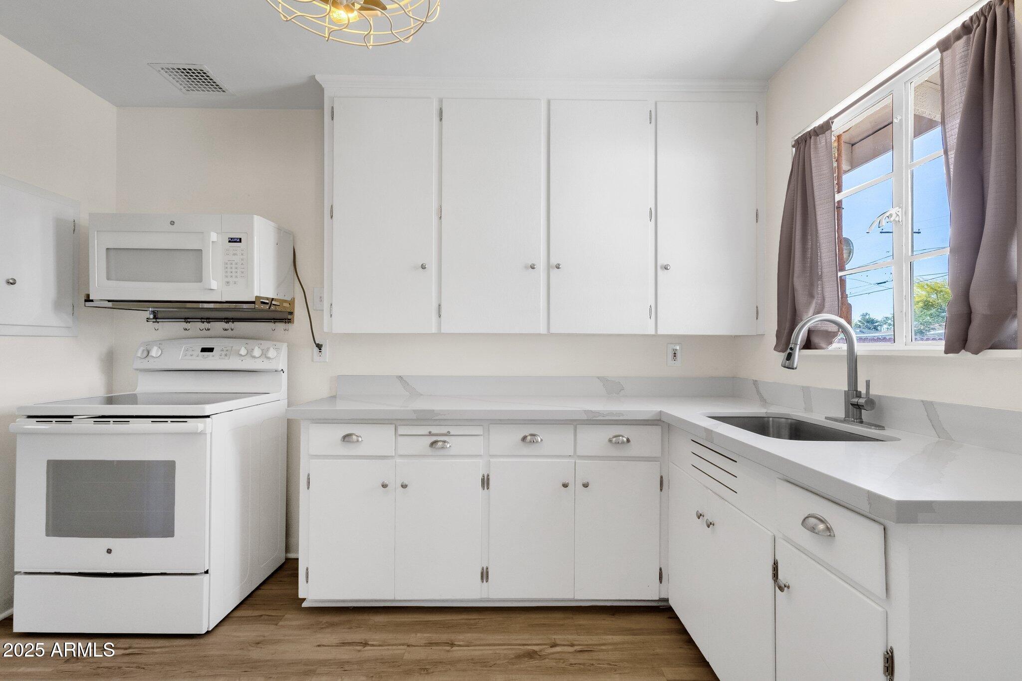 1944 West Osborn Road Phoenix, AZ 85015 - Photo 18 of 37 Beautiful white kitchen cabinets