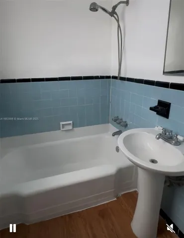 a bathroom with a sink and a bathtub