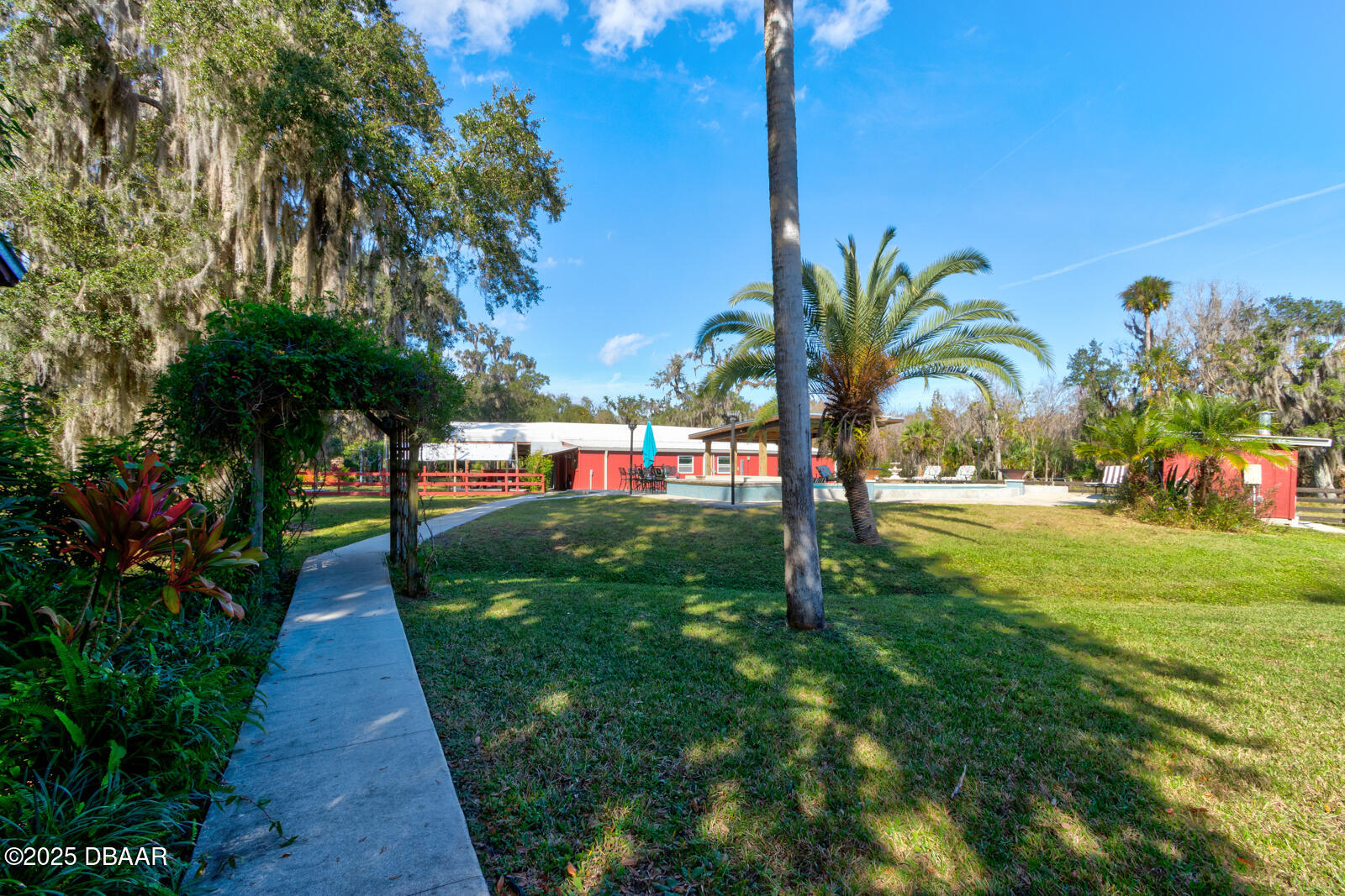 3051 Ragis Road Edgewater, FL 32132 - Photo 57 of 76 Walkway to pool & outdoor areas
