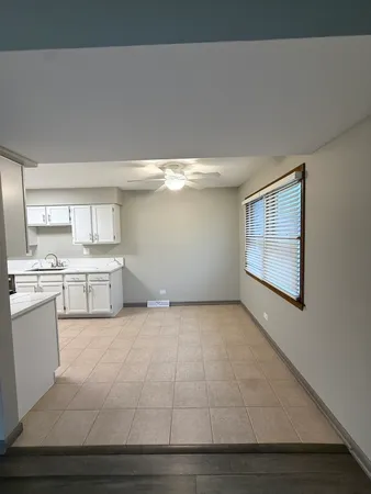 a view of a kitchen with a sink and dishwasher