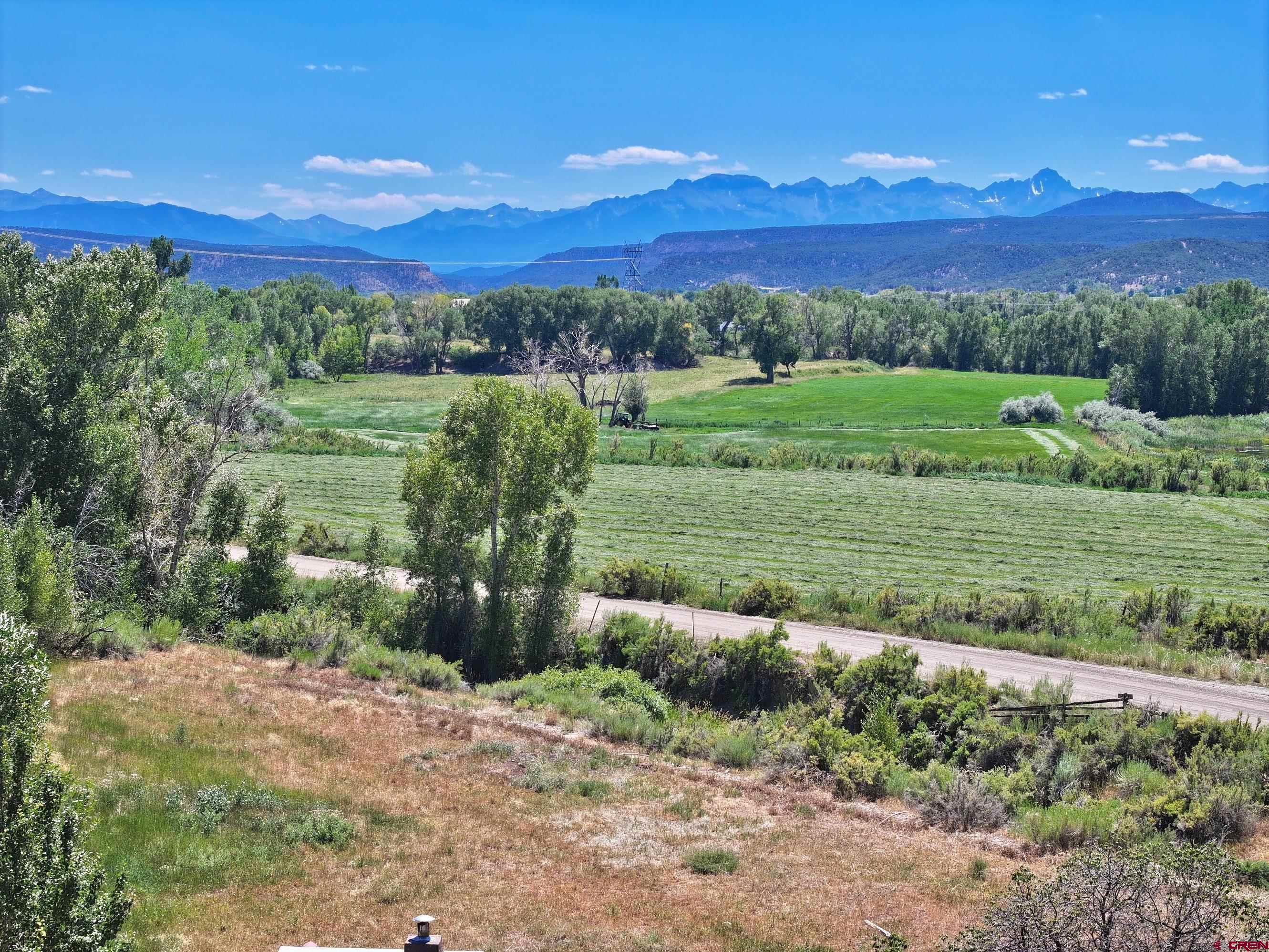 Tbd Lot 3 Uncompahgre Road Montrose, CO 81403 - Photo 3 of 9 a view of a field with an ocean