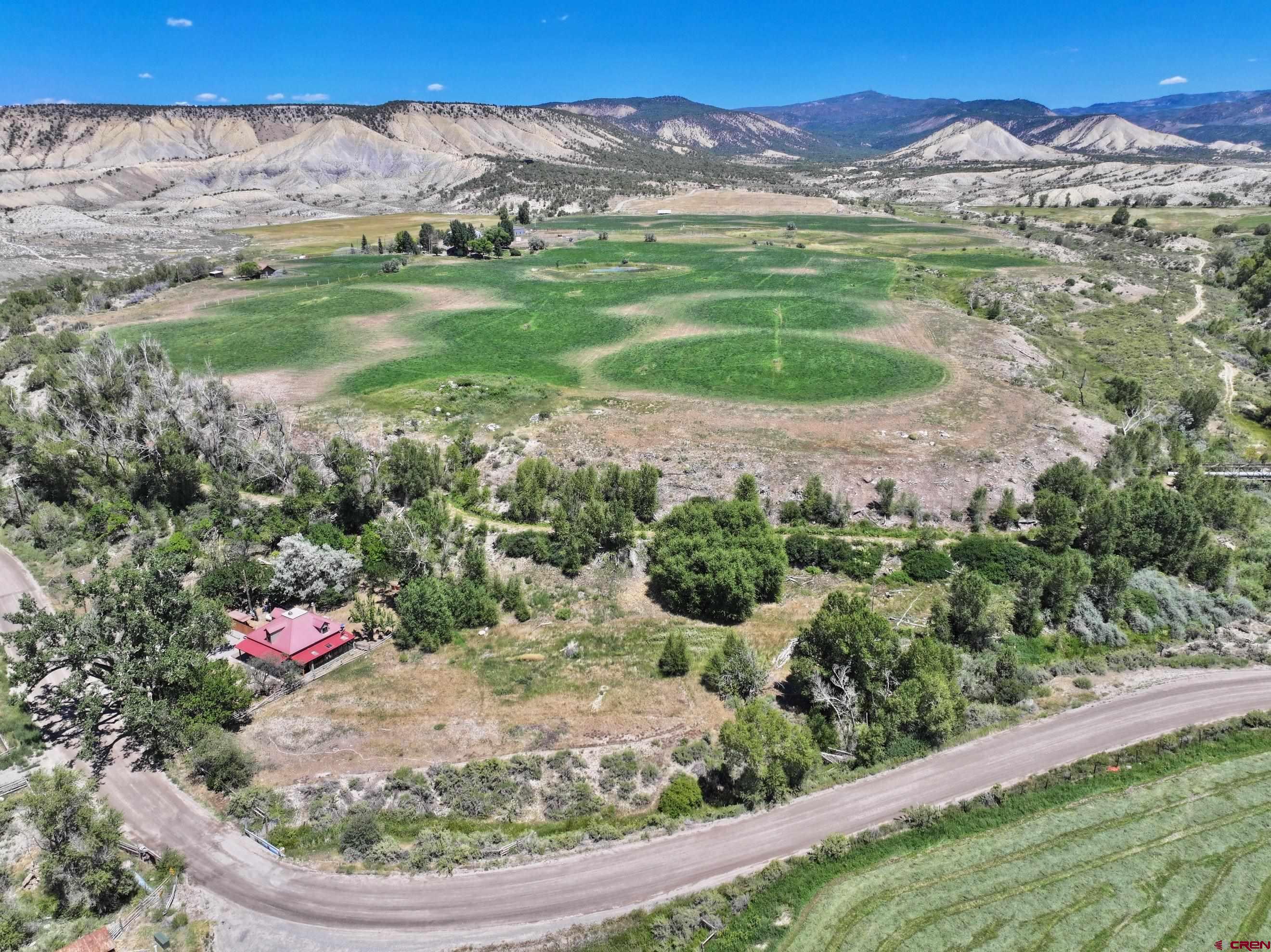 Tbd Lot 3 Uncompahgre Road Montrose, CO 81403 - Photo 5 of 9 a view of a garden with a lake