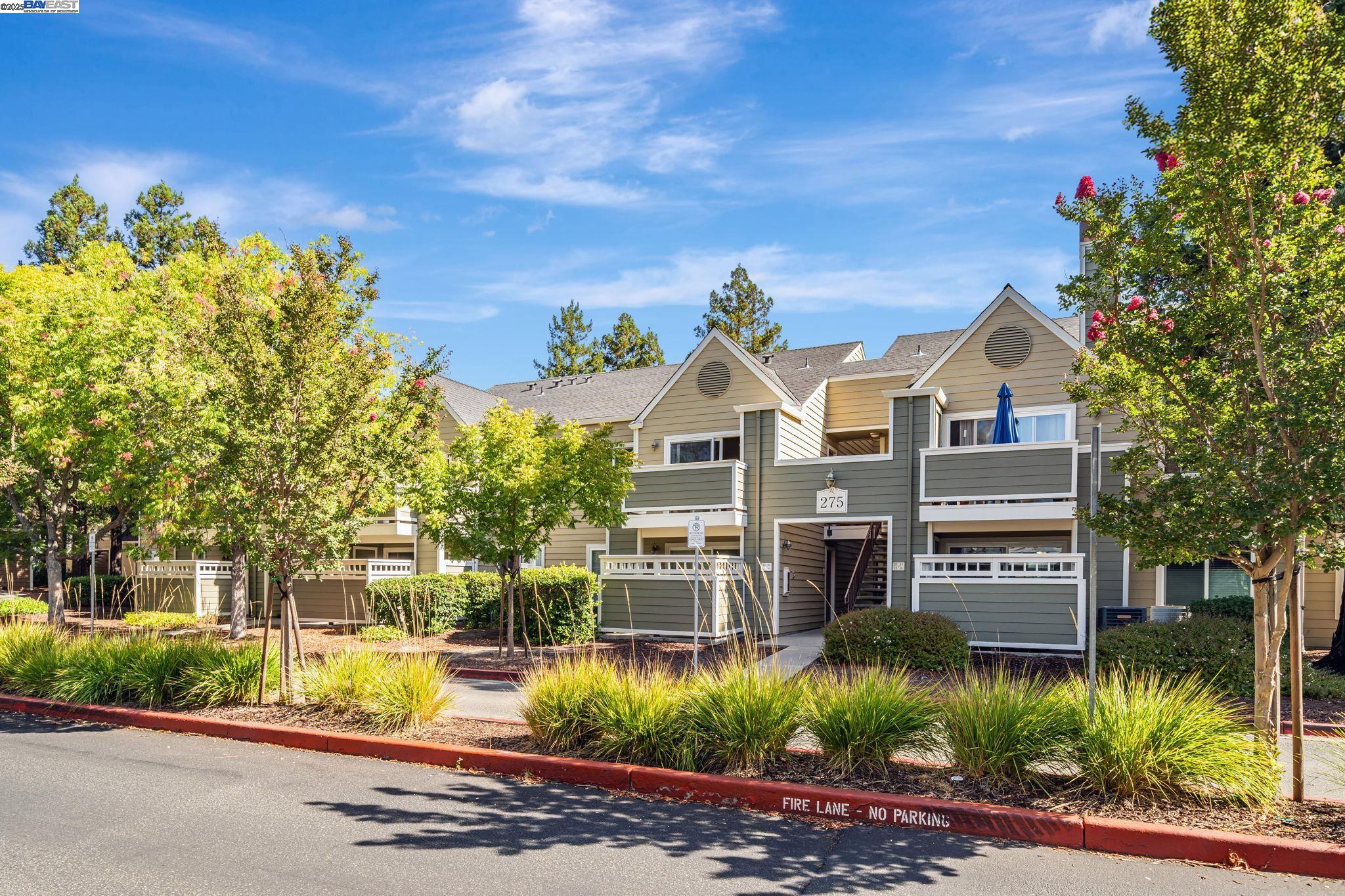 275 Reflections Drive, Unit 23 San Ramon, CA 94583 - Photo 1 of 1 a view of a big house with a street and plants