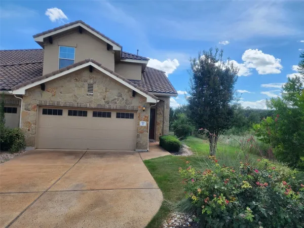 a front view of house with garden