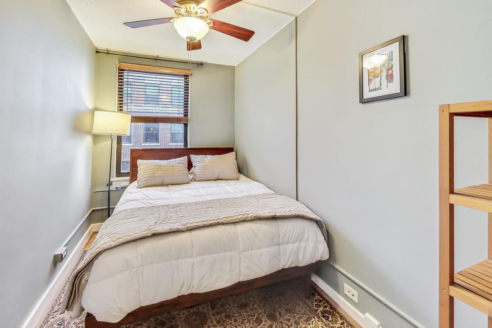 725 West Sheridan Road, Unit 601 Chicago, IL 60613 - Photo 11 of 23 a bedroom with a bed and a window