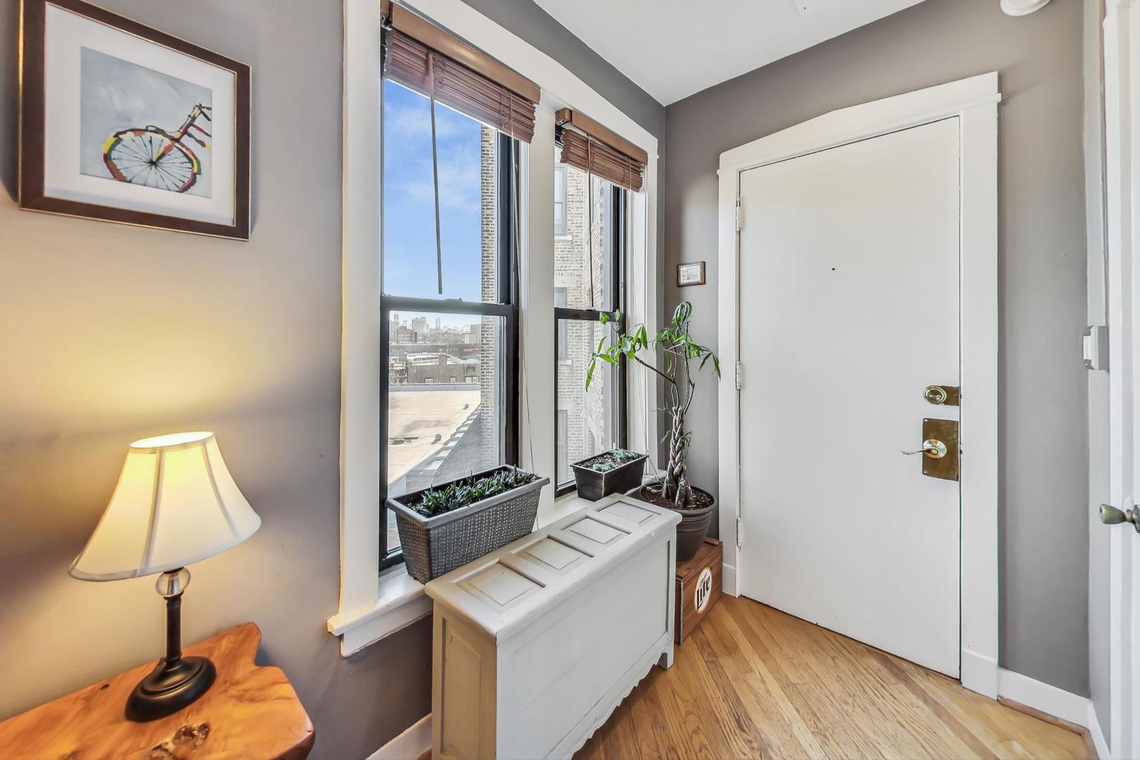 725 West Sheridan Road, Unit 601 Chicago, IL 60613 - Photo 14 of 23 a room with furniture and a window