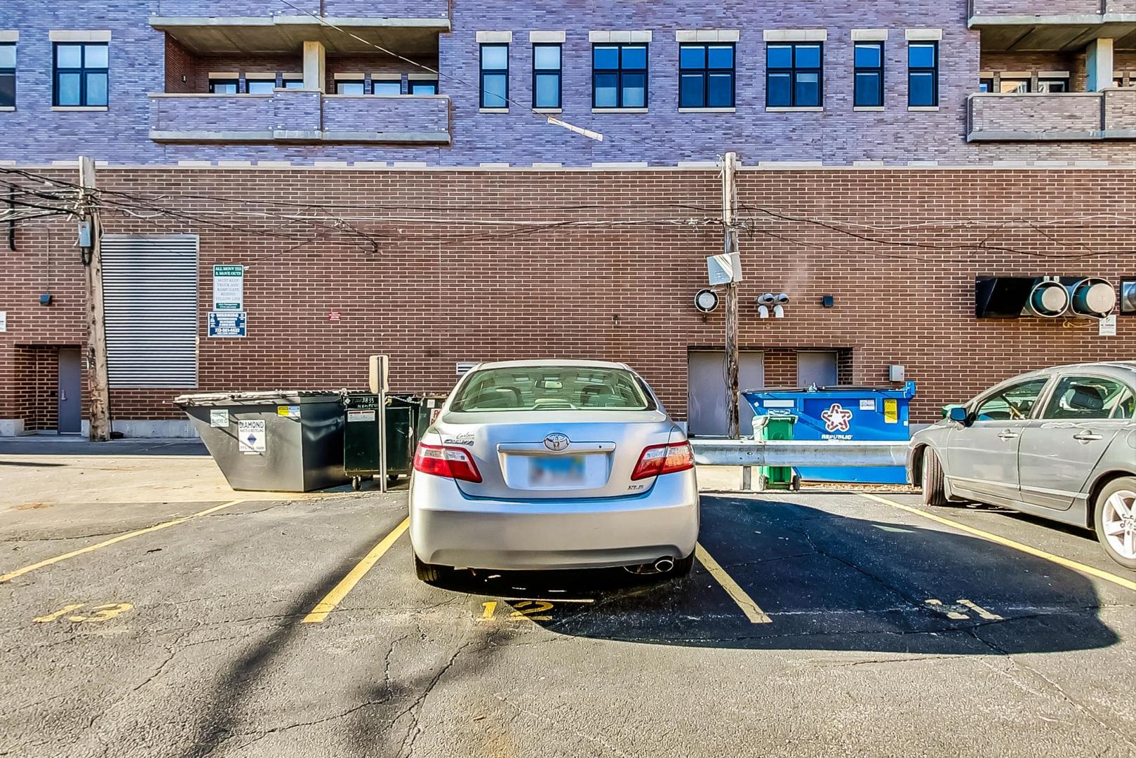 725 West Sheridan Road, Unit 601 Chicago, IL 60613 - Photo 19 of 23 a car parked in front of a brick building