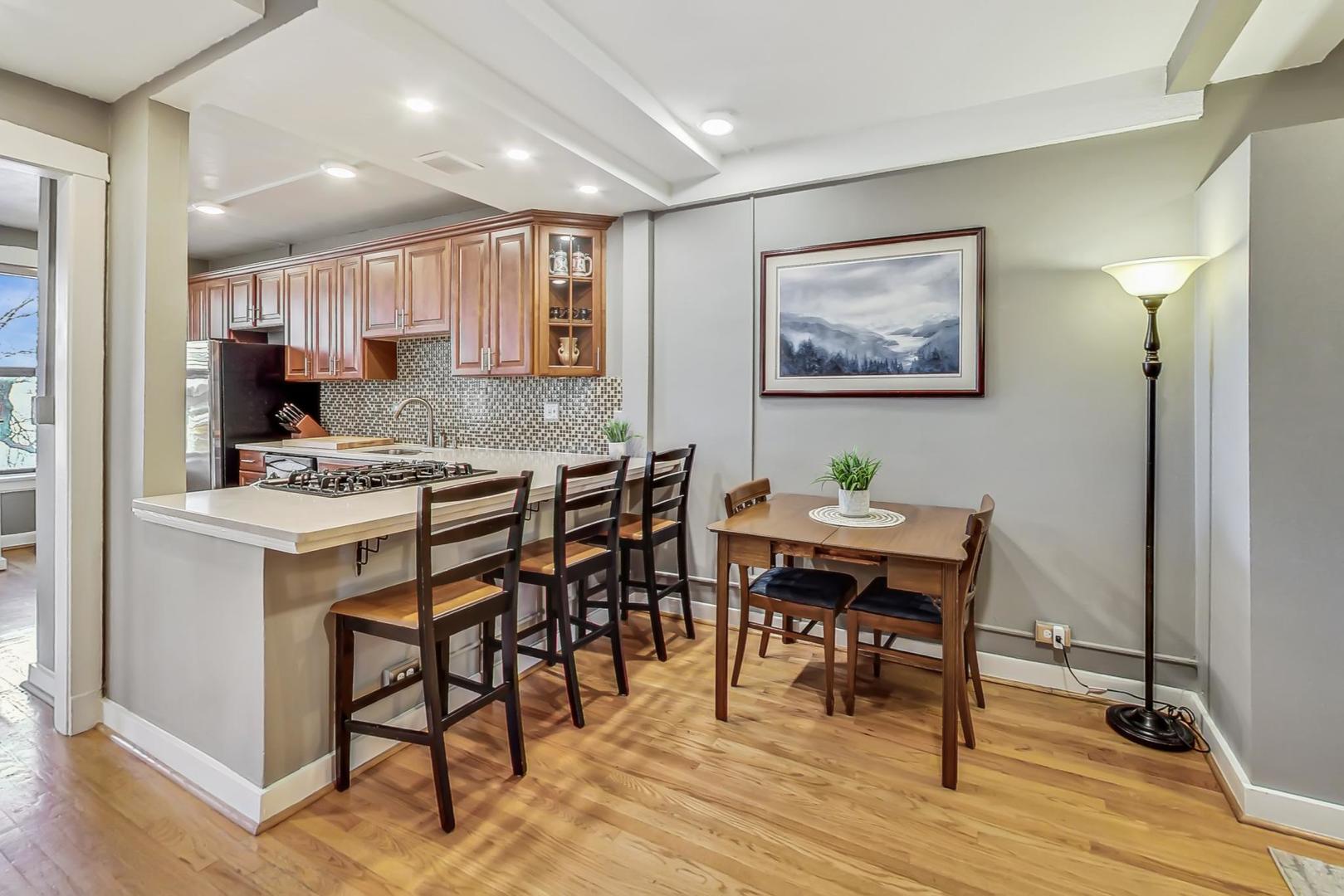 725 West Sheridan Road, Unit 601 Chicago, IL 60613 - Photo 9 of 23 a view of a dining room with furniture