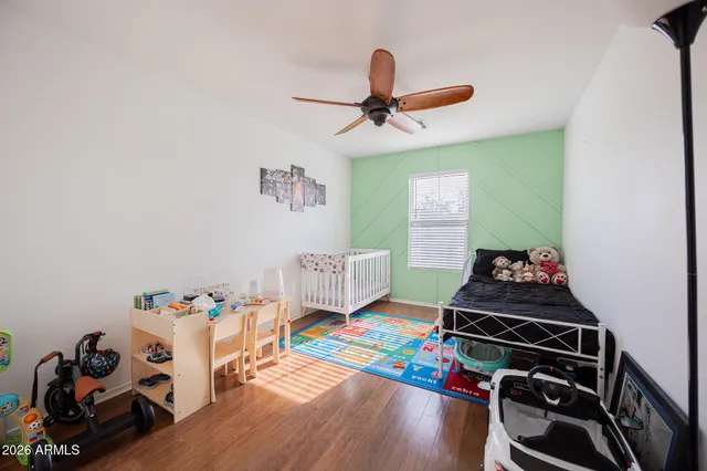 a room with furniture and a wooden floor