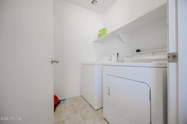 a utility room with dryer and washer