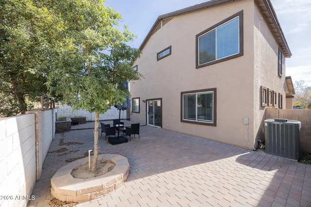 a backyard of a house with seating space
